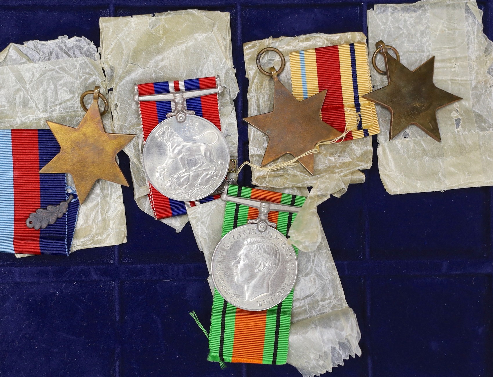 A WWII group of 5 including war medal with oak leaf and 1939-45 star with oak leaf to L.E. TYLER, 8th Army bar (with named box)